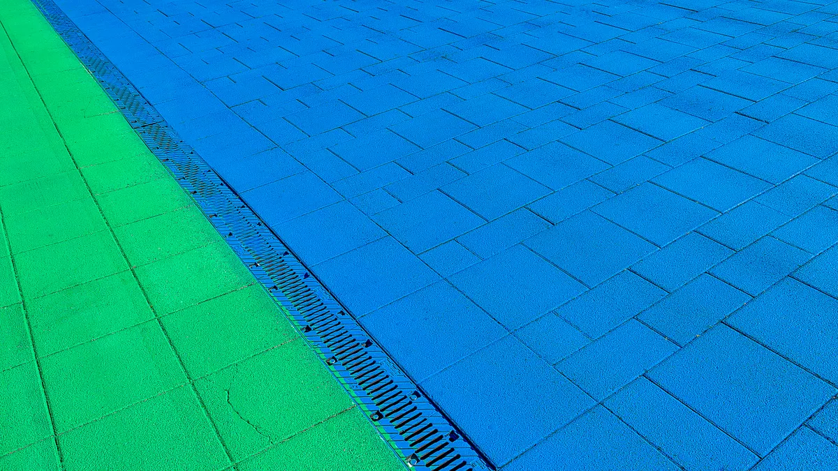 Outdoor kitchen drainage: slope, runoff, and standing water fixes Paved surface with a linear drainage grate