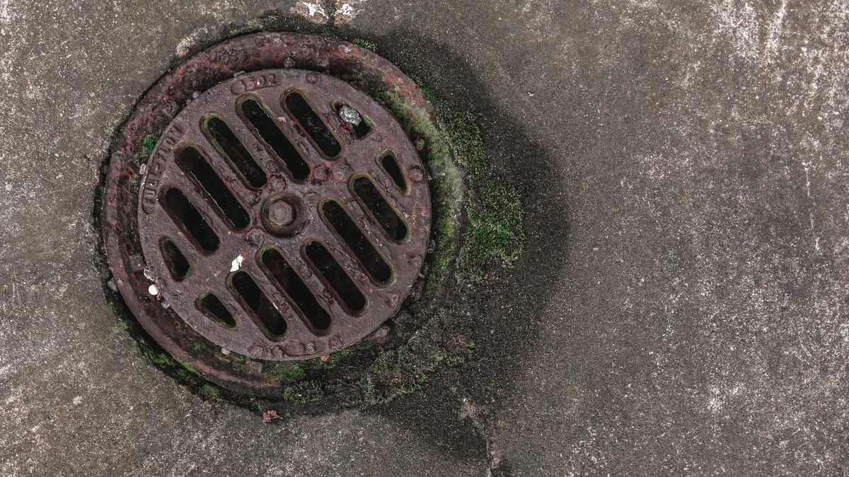 Outdoor kitchen drainage: slope, runoff, and standing water fixes Round storm drain cover in concrete