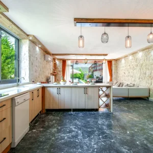 Covered outdoor kitchen with counters and sink